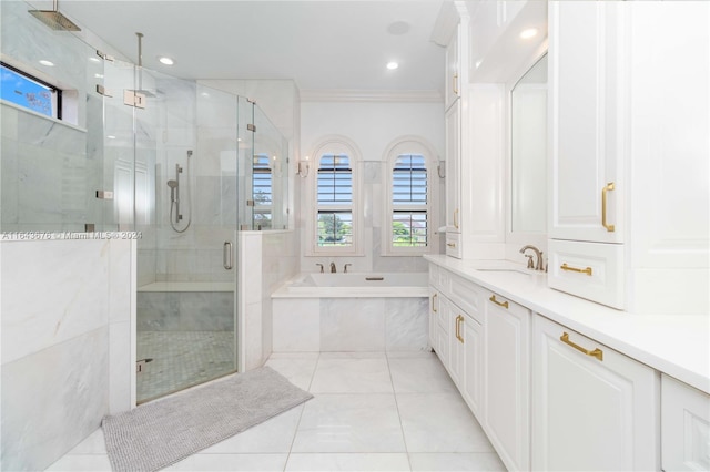 bathroom featuring tile patterned flooring, independent shower and bath, ornamental molding, and vanity