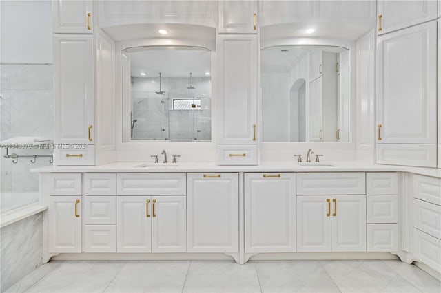 bathroom with vanity, a shower with shower door, and tile patterned floors