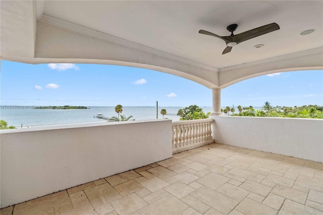 view of patio / terrace featuring a balcony and a water view