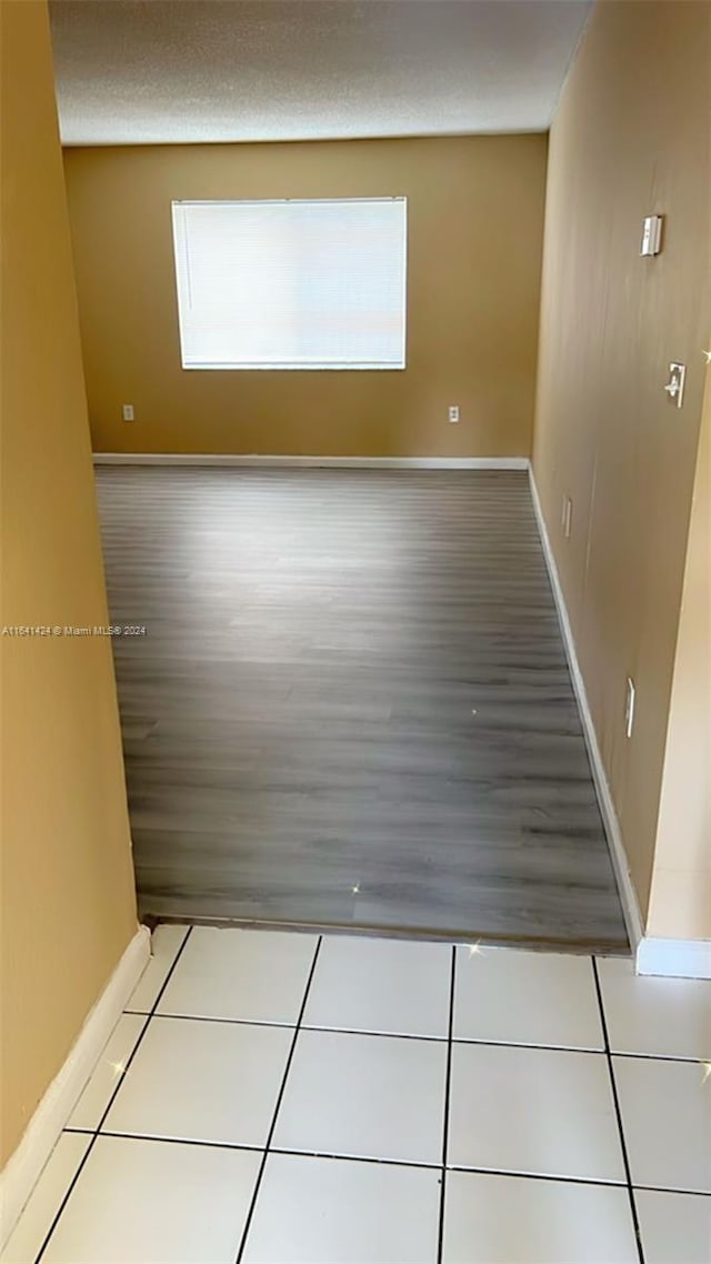 unfurnished room with light wood-type flooring