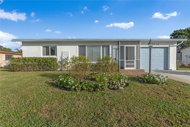 view of front facade with a front lawn and a garage