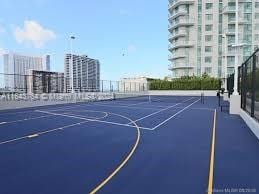 view of basketball court with tennis court