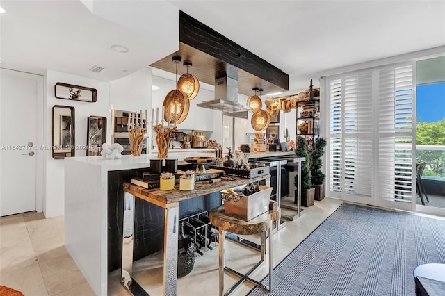 tiled living room featuring bar and a barn door