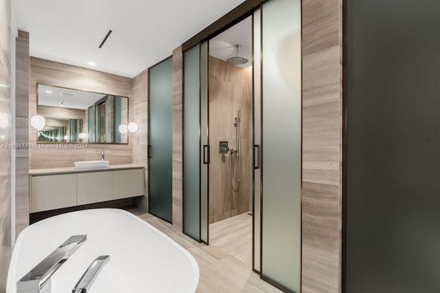 bathroom with vanity, shower with separate bathtub, and tile patterned floors