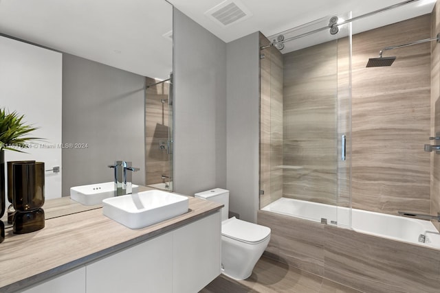 bathroom with vanity, floor to ceiling windows, hardwood / wood-style floors, and a washtub