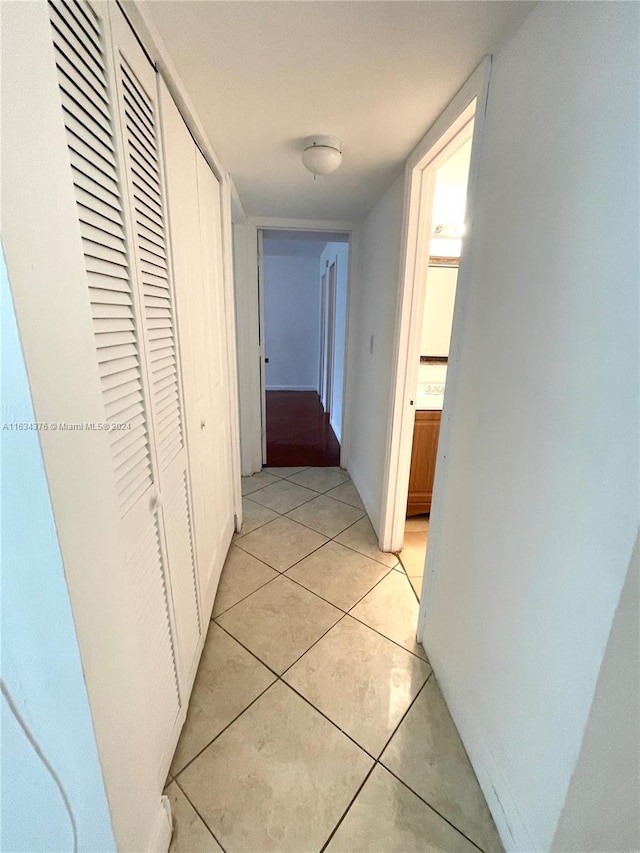 hallway with light tile patterned floors