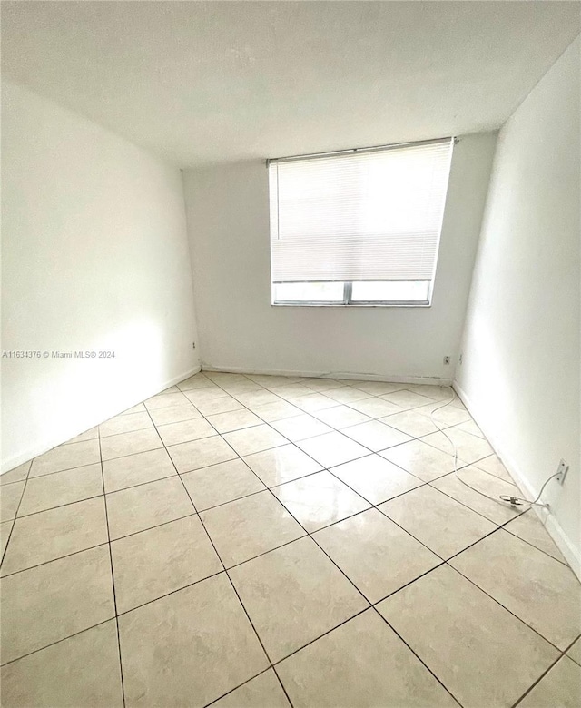 view of tiled spare room