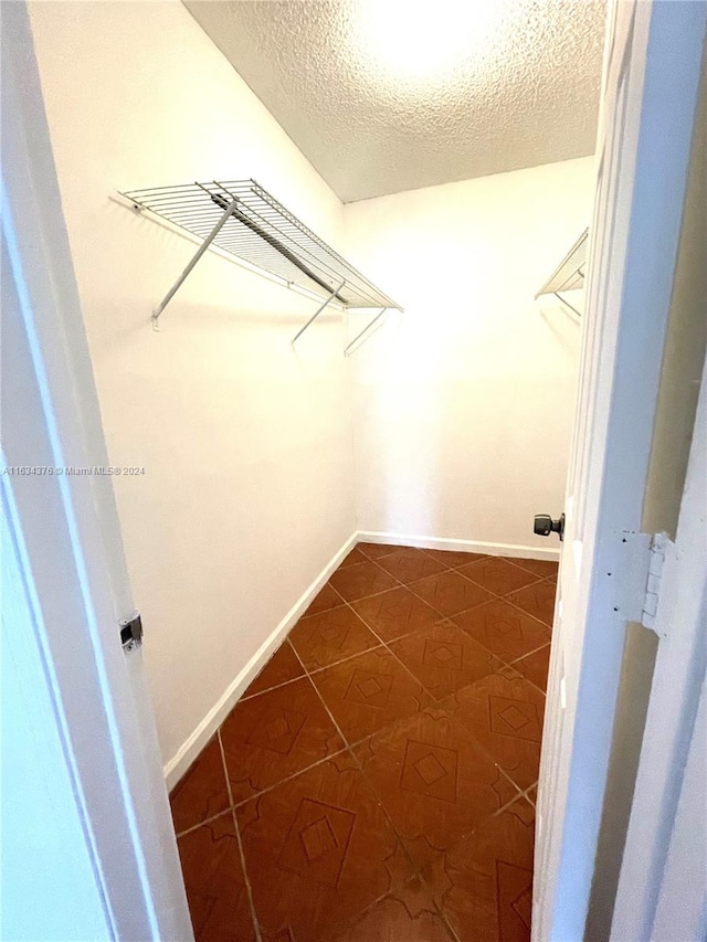 spacious closet featuring tile patterned floors