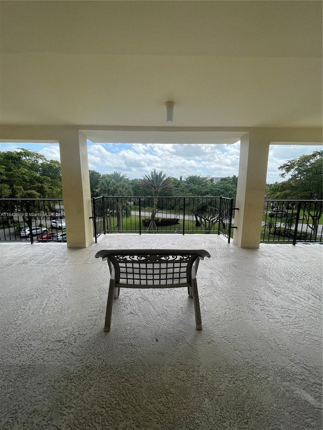 view of patio featuring a balcony