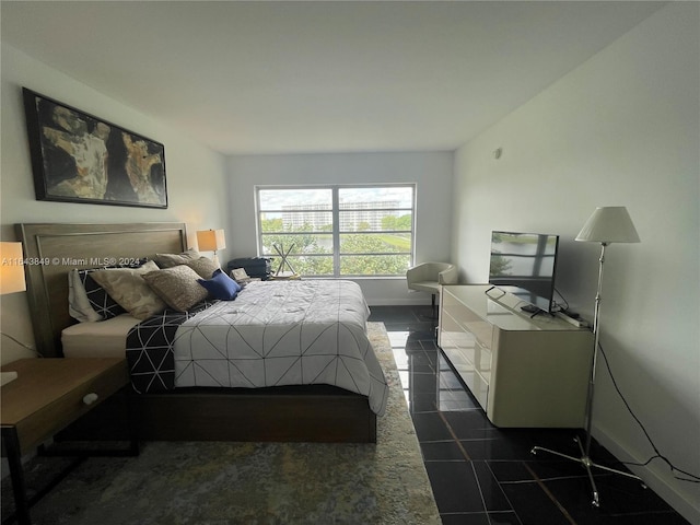 bedroom featuring dark tile patterned floors