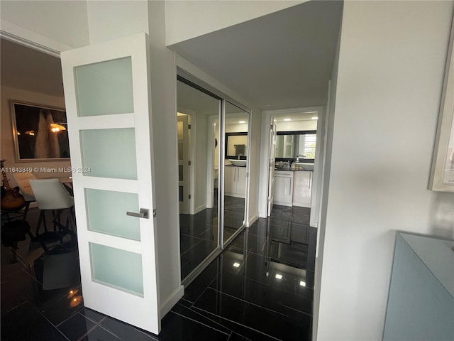 interior space with dark tile patterned floors