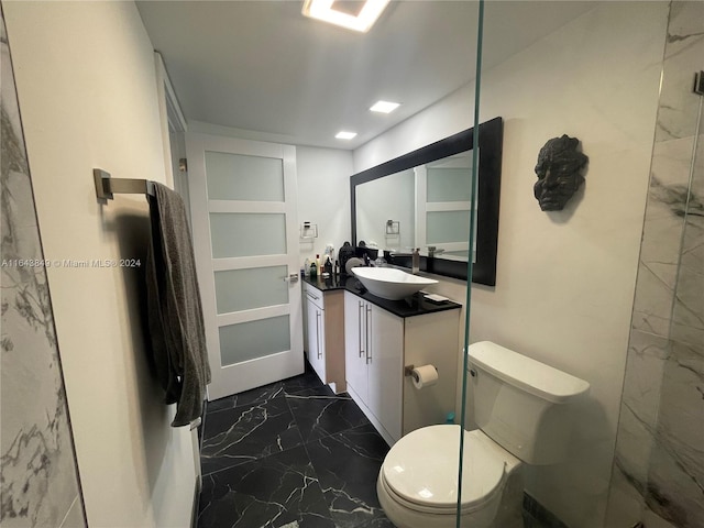 bathroom with tile patterned floors, vanity, and toilet