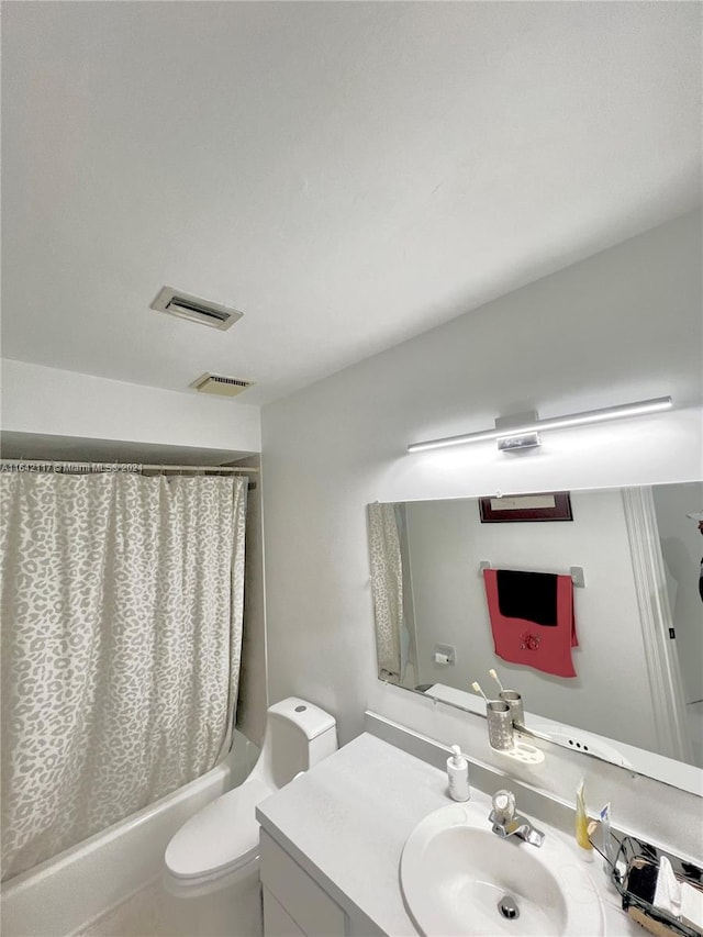 full bathroom with toilet, vanity, and shower / bathtub combination with curtain