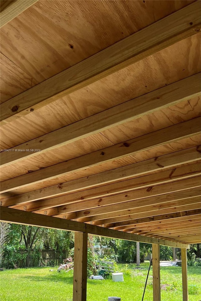 exterior details featuring wood ceiling and beam ceiling