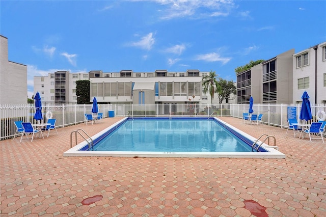 view of pool featuring a patio