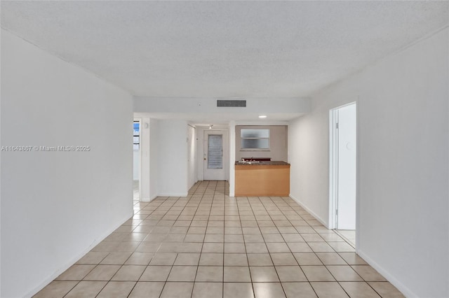 interior space with a textured ceiling