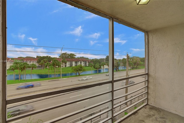 balcony featuring a water view