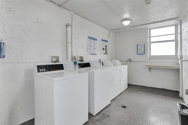 clothes washing area featuring independent washer and dryer