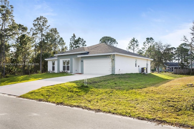 view of front facade featuring a front yard and a garage