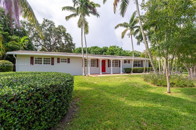 ranch-style home with a front yard