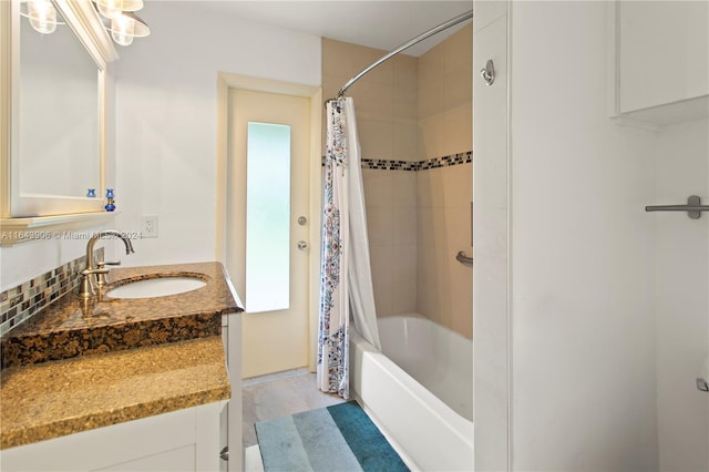 bathroom with hardwood / wood-style flooring, shower / tub combo with curtain, and vanity