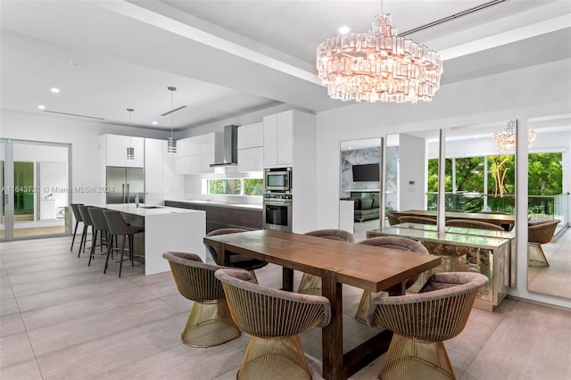 dining room with a tray ceiling and an inviting chandelier