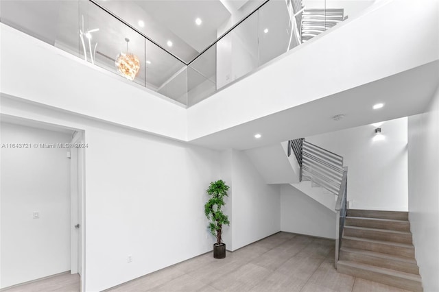 interior space featuring hardwood / wood-style floors and a high ceiling