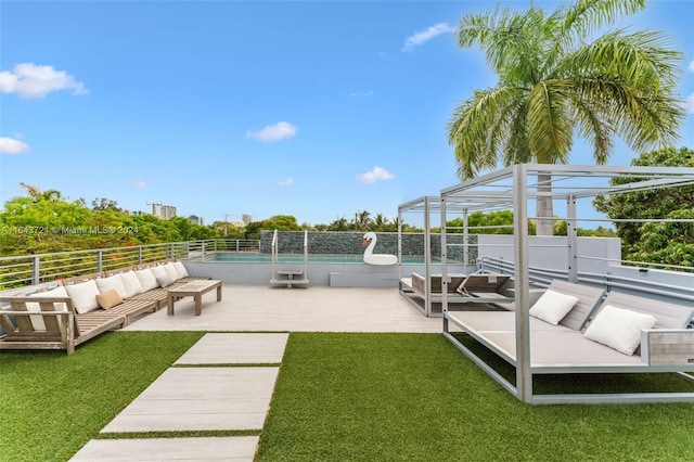 view of dock featuring a lawn, an outdoor living space, and a fenced in pool