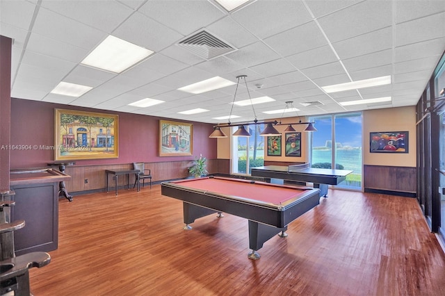 rec room with a paneled ceiling, pool table, and wood-type flooring