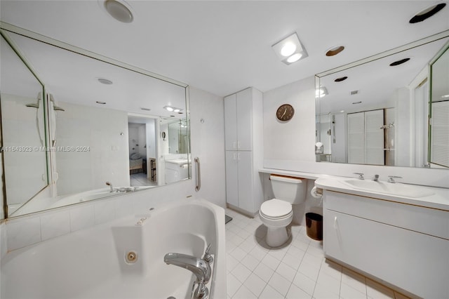 bathroom featuring tile patterned flooring, toilet, and vanity