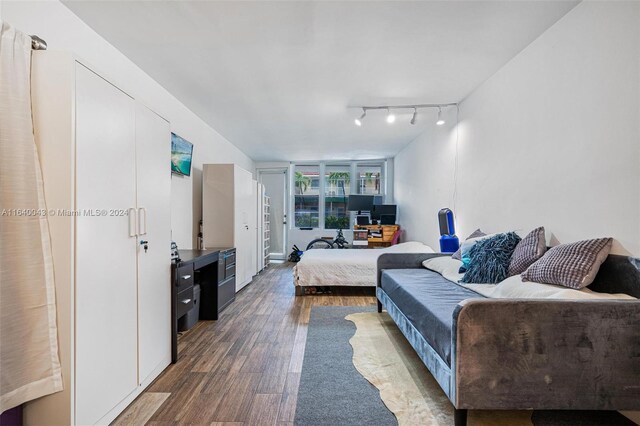 living room featuring hardwood / wood-style flooring and track lighting