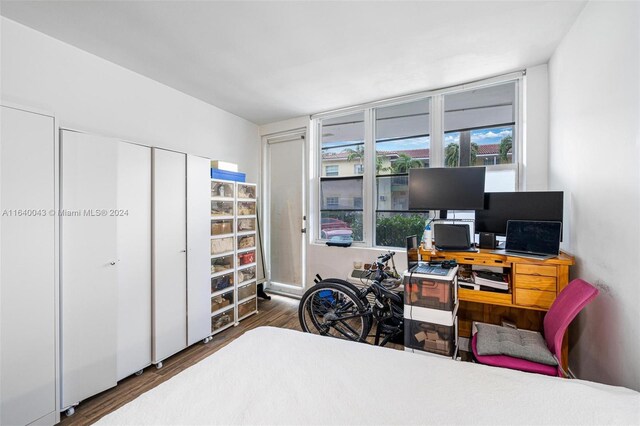 office space with dark wood-type flooring