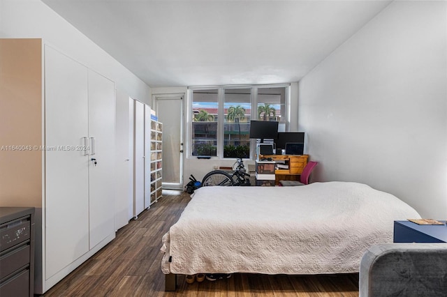 bedroom featuring dark wood-type flooring