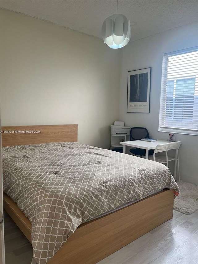 bedroom featuring light wood-type flooring