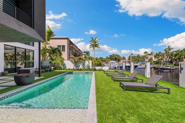 view of pool featuring a yard