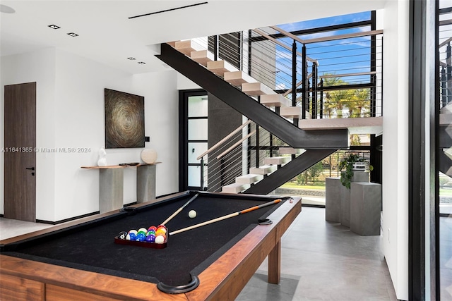 recreation room with billiards and a healthy amount of sunlight