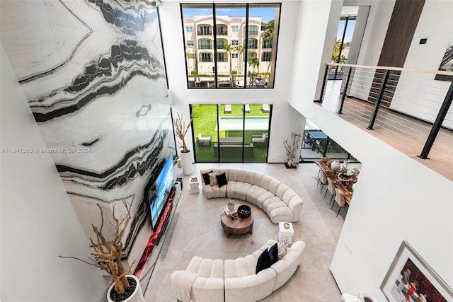 living room featuring light wood-type flooring and plenty of natural light