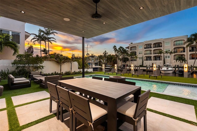 view of patio terrace at dusk