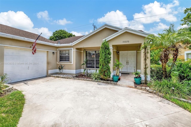 ranch-style home featuring a garage