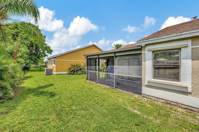 view of yard with cooling unit and a sunroom