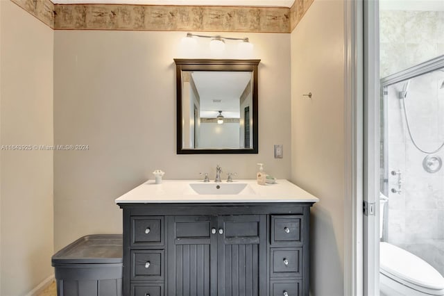 bathroom featuring toilet and vanity