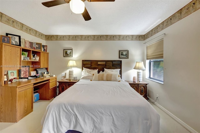 bedroom featuring ceiling fan, a textured ceiling, and light tile patterned flooring