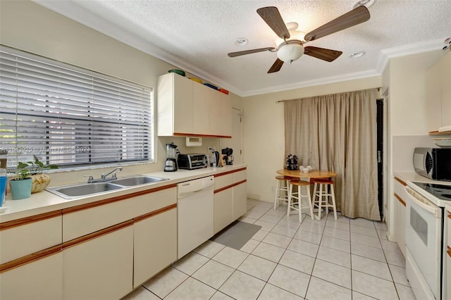 kitchen with ceiling fan, sink, crown molding, light tile patterned flooring, and white appliances