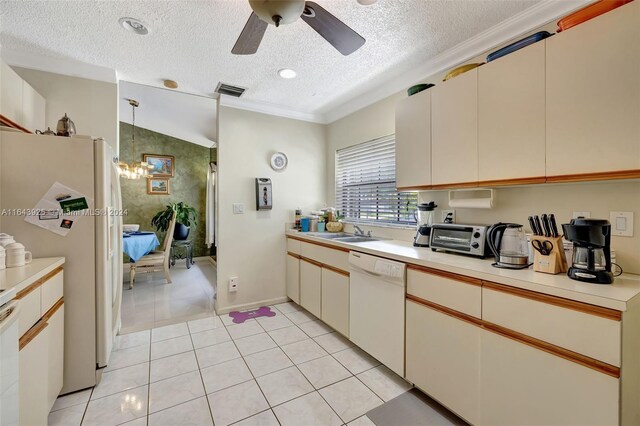 kitchen featuring sink, white appliances, ceiling fan with notable chandelier, a textured ceiling, and light tile patterned floors