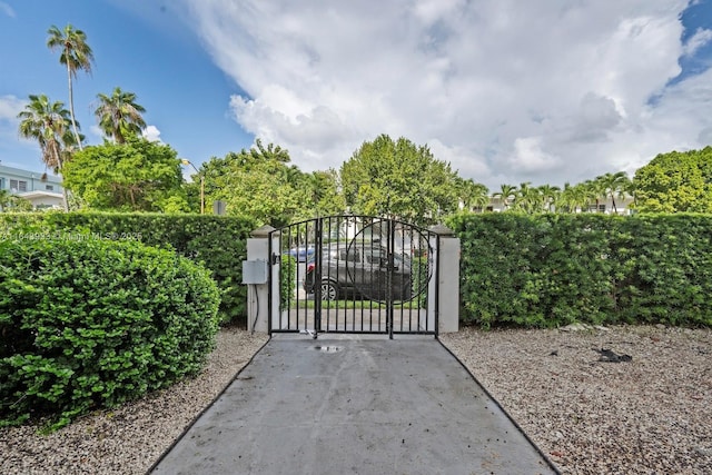 view of gate featuring fence