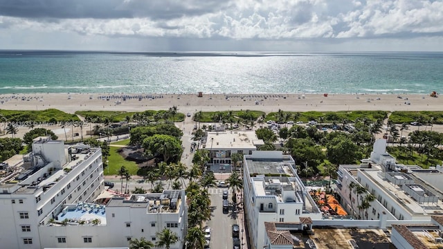 bird's eye view featuring a water view and a view of the beach