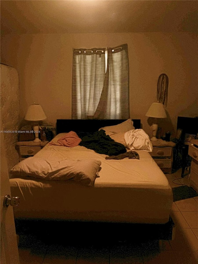 bedroom featuring tile patterned floors