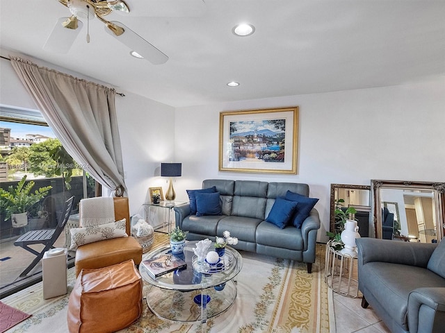 living room featuring ceiling fan and light tile patterned floors