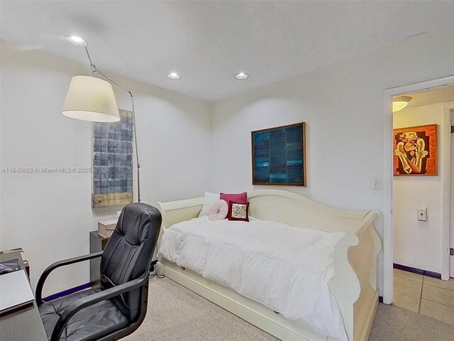 living room featuring light tile patterned floors and ceiling fan with notable chandelier