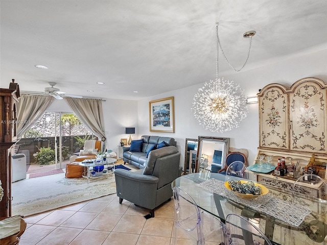 tiled living room featuring ceiling fan with notable chandelier